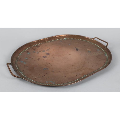 84 - An Arts and Crafts Hand Beaten Copper Oval Two Handled Tray Stamped JP for John Pearson, 43cms Wide