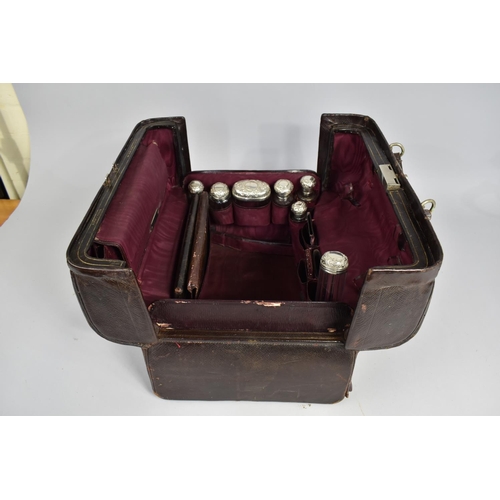 92 - A Victorian Fitted Vanity Case by Asprey containing Many Original Silver Topped Glass Bottles, Boxes... 