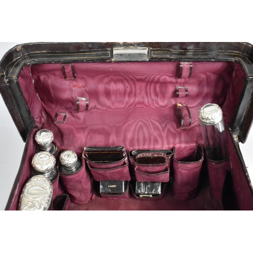 92 - A Victorian Fitted Vanity Case by Asprey containing Many Original Silver Topped Glass Bottles, Boxes... 