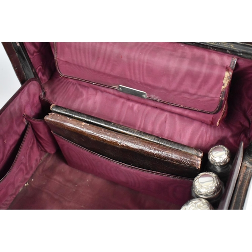 92 - A Victorian Fitted Vanity Case by Asprey containing Many Original Silver Topped Glass Bottles, Boxes... 