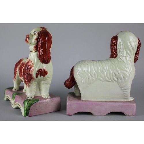 114 - A Pair of Reproduction Staffordshire Spaniels, 24cms high