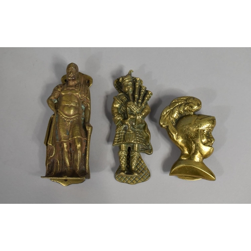 126 - A Collection of Three Novelty Brass Door Knockers, One in the Form of a Roman Soldier, One A Scottis... 