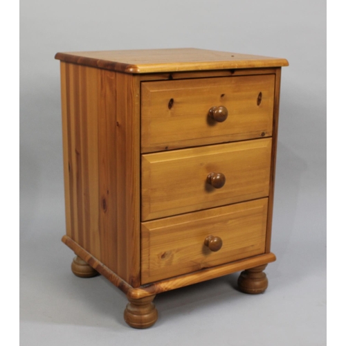 129 - A Modern pine Three Drawer Bedside Chest, 43cms Wide