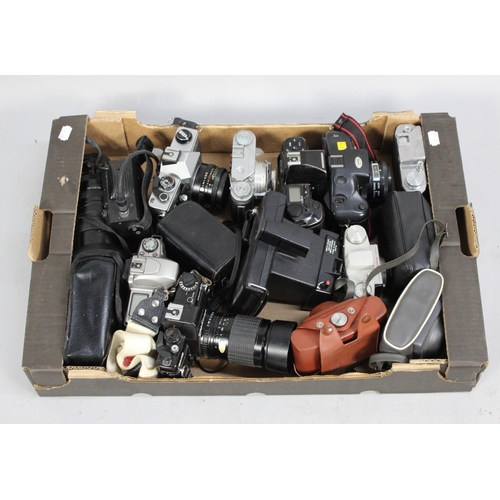 233 - A Collection of Various Vintage Cameras to include Praktica, Nikon, Polaroid Etc