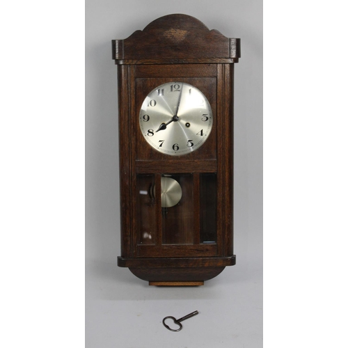 238 - A Edwardian Oak Wall Clock, 65cms Wide