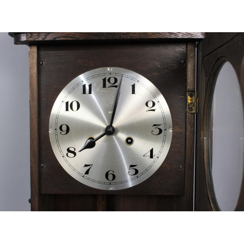 238 - A Edwardian Oak Wall Clock, 65cms Wide