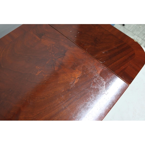 32 - A Reproduction Crossbanded Mahogany Drop Leaf Coffee Table in the Form of a Sofa Table with Single L... 