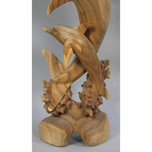 80 - A Large Modern Sculptural Carving of Dolphins, 101cms High