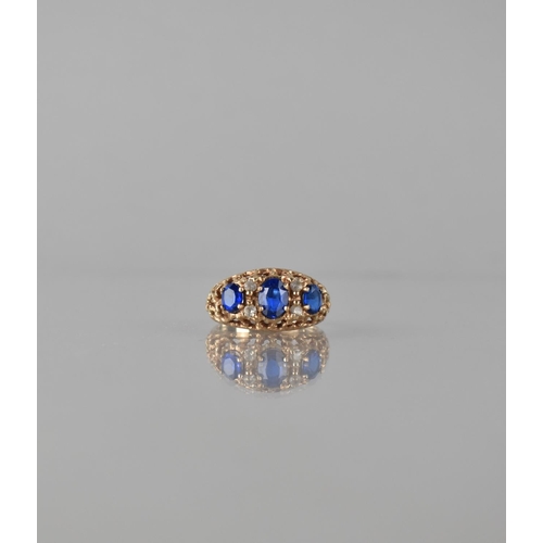 83 - A Late 20th Century 9ct Gold and Sapphire Seven Stone Dress Ring. Central Oval Cut Sapphire Measurin... 