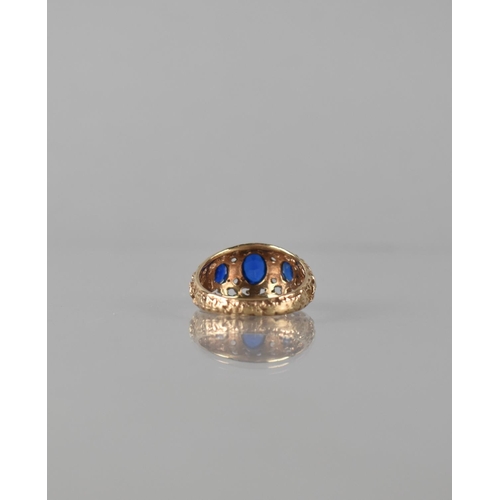 83 - A Late 20th Century 9ct Gold and Sapphire Seven Stone Dress Ring. Central Oval Cut Sapphire Measurin... 