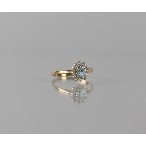 70 - A Modern 9ct Gold, Sapphire and CZ Dress Ring, Central Oval Cut Stone Measuring Approx 5mm by 4mm an... 