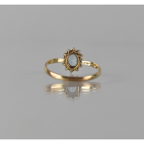 70 - A Modern 9ct Gold, Sapphire and CZ Dress Ring, Central Oval Cut Stone Measuring Approx 5mm by 4mm an... 