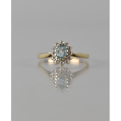 70 - A Modern 9ct Gold, Sapphire and CZ Dress Ring, Central Oval Cut Stone Measuring Approx 5mm by 4mm an... 