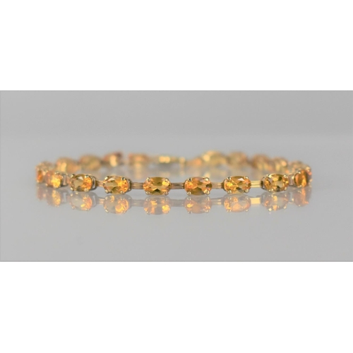 139 - A 9ct Gold and Citrine Tennis Bracelet Comprising 20 Oval Cut Stones, Each Approx 6mm by 4mm, Mounte... 