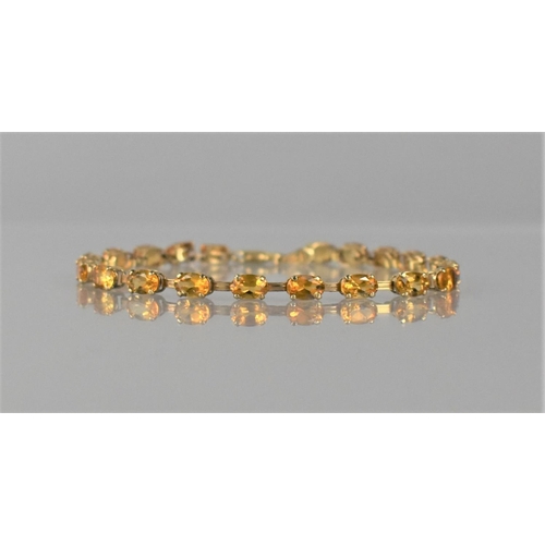 139 - A 9ct Gold and Citrine Tennis Bracelet Comprising 20 Oval Cut Stones, Each Approx 6mm by 4mm, Mounte... 