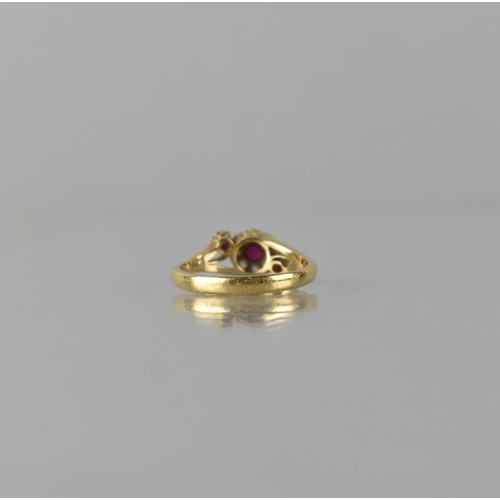 63 - An 18ct Gold, Diamond and Ruby Floral Cluster Ring, Centre Round Cut Ruby Measuring Approx 3mm Diame... 