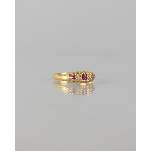 67 - An 18ct Gold, Ruby and Diamond Seven Stone Boat Ring, Central Mixed Cut Ruby Measuring 3.5mm by 2mm ... 