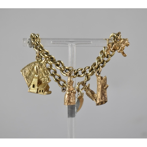 145 - A 9ct Gold Charm Bracelet, Five 9ct Gold Charms on Curb Link Bracelet to include Horse Head, Lion, A... 