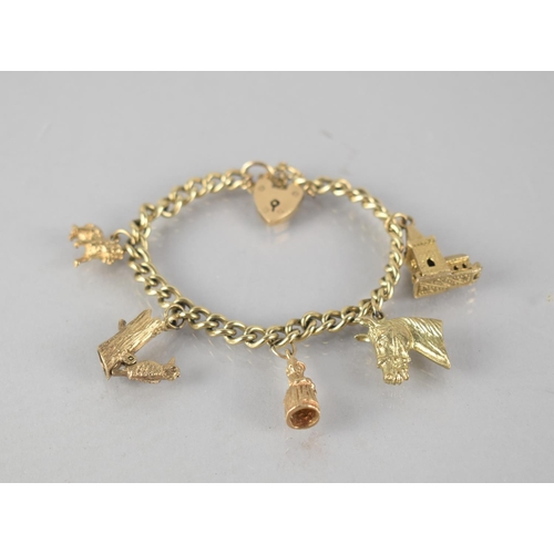 145 - A 9ct Gold Charm Bracelet, Five 9ct Gold Charms on Curb Link Bracelet to include Horse Head, Lion, A... 