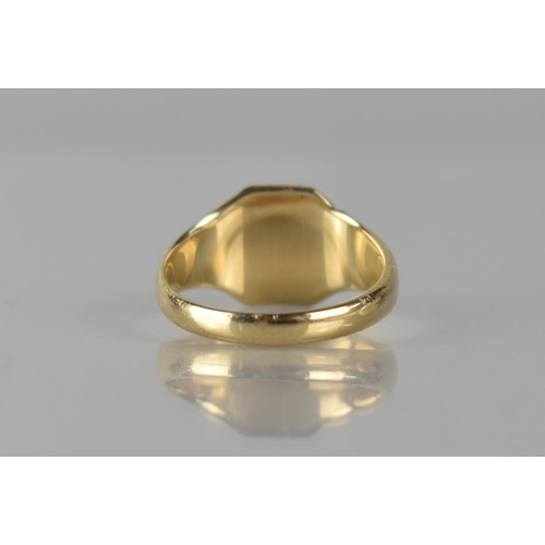 56 - A 9ct Gold Gents Signet Ring, Octagonal Head with Traces of Engraved Decoration, Stepped Shoulders t... 