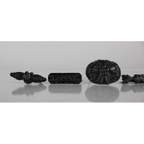 264 - A Collection of Five Victorian and Later Jet Brooches together with Two Black Glass Examples, Larges... 