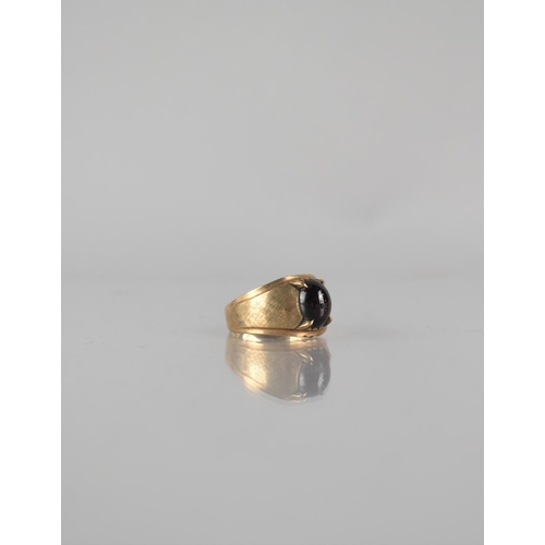 26 - A 9ct Gold and Garnet Ring, Centre Stone Measuring 10mm by 7.5mm Approx, Four Claw Setting to Textur... 