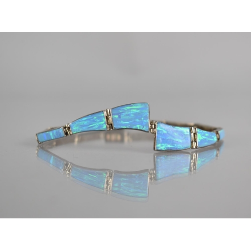 292 - An Opal and Silver Panel Bracelet, 12 Collet Mounted Opal Panels, Largest Measuring 13mm by 10mm Max... 