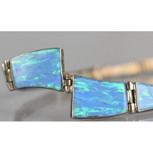 292 - An Opal and Silver Panel Bracelet, 12 Collet Mounted Opal Panels, Largest Measuring 13mm by 10mm Max... 