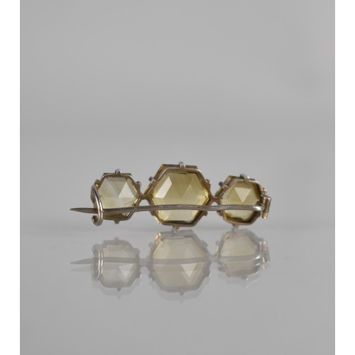 297 - A Three Stone Citrine Bar Brooch, Hexagonal Cut Stones, Largest Measuring 11mm Wide, Mounted in Six ... 