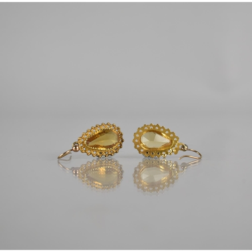 108 - A Pair of Indian Style Yellow Metal and Citrine Drop Earrings,  Central Mixed Cut Pear Shaped Stone ... 