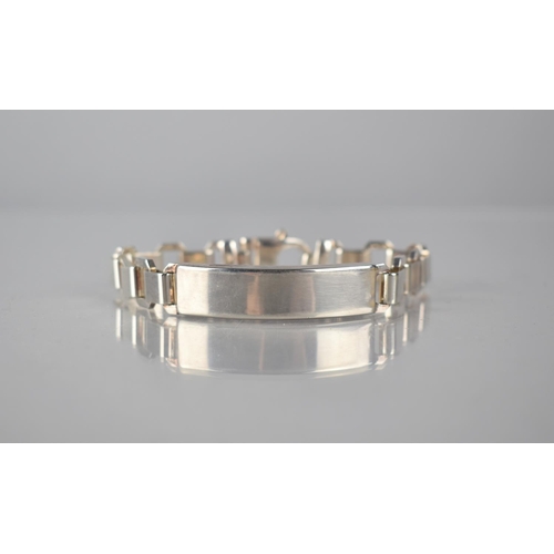 300 - A Heavy Silver Identity Bracelet, Rectangular Polished Panel, with Octagonal and Square Alternating ... 