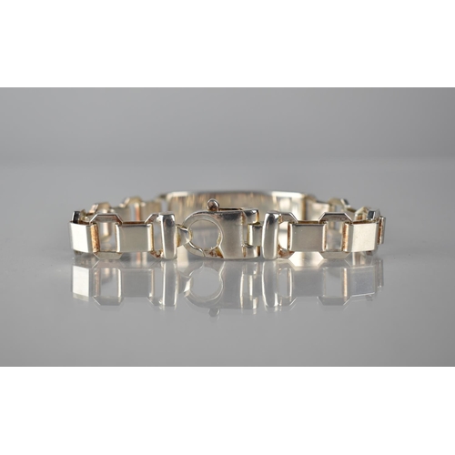 300 - A Heavy Silver Identity Bracelet, Rectangular Polished Panel, with Octagonal and Square Alternating ... 