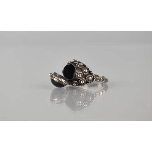 208 - A Mexican Silver and Onyx 'Poison Ring', Oval Cabochon Onyx Stone (10mm by 8mm) to Hinged Head revea... 