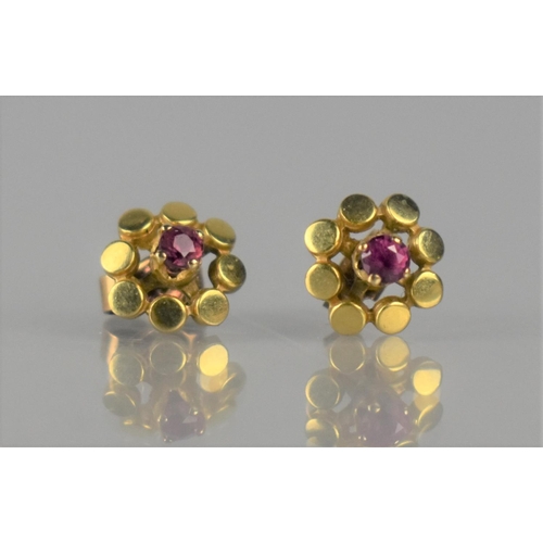 137 - A Pair of Ruby and 9ct Gold Earrings, Small Round Cut Rubies Measuring Approx 2mm Diameter, Supporte... 