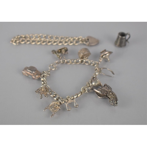 308 - A Continental Silver Charm Bracelet having Ten Various Charms to comprise Cupid, Libra, Hinged Fishi... 