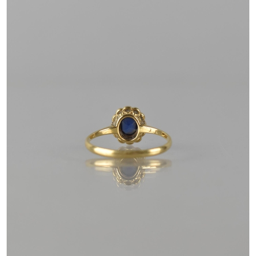 62 - An 18ct Gold and Platinum Mounted Sapphire and Diamond Ring, Centre Elongated Cushion Cut Sapphire M... 