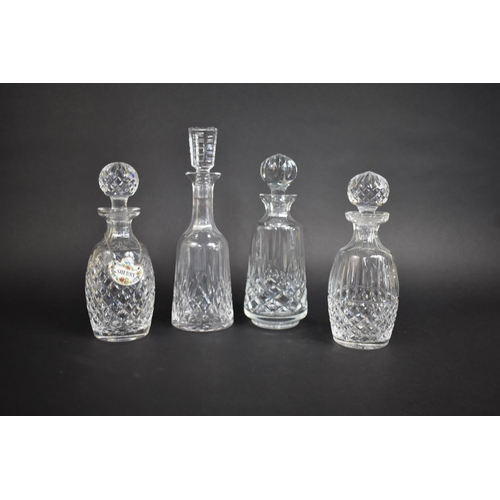 239 - A Collection of Four Waterford Crystal Decanters, One With Ceramic Sherry Label by Coalport