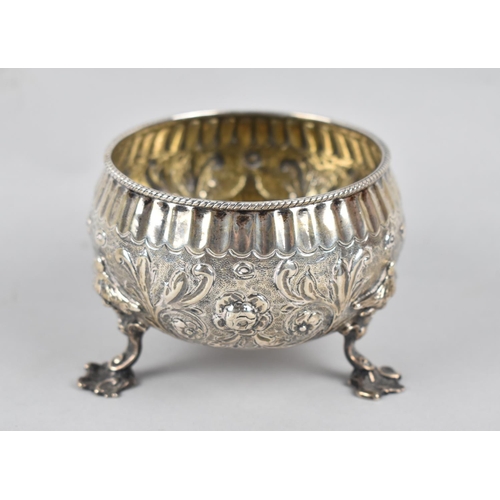 257 - A Silver Sugar Bowl with Repousse Decoration on Three Feet, 171gms, London Hallmark, Together with A... 