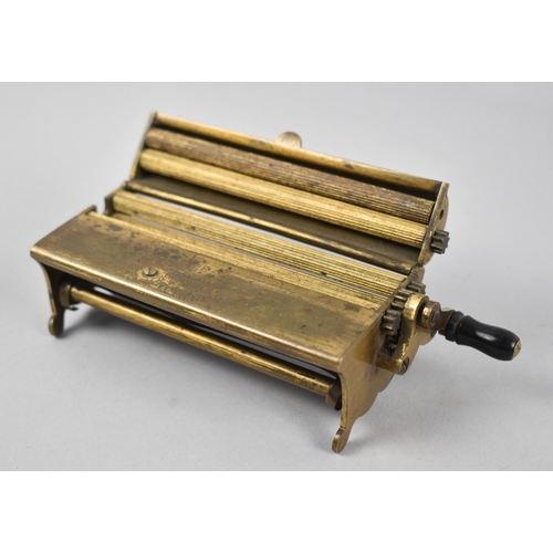 29 - A Vintage Brass Cigarette Rolling Machine, The Concinnum, 13cms Wide