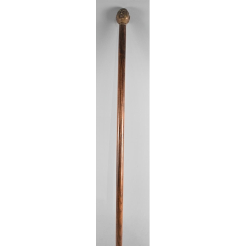 32 - A Modern Turned Walking Cane with Buddha Four Faced Novelty Handle