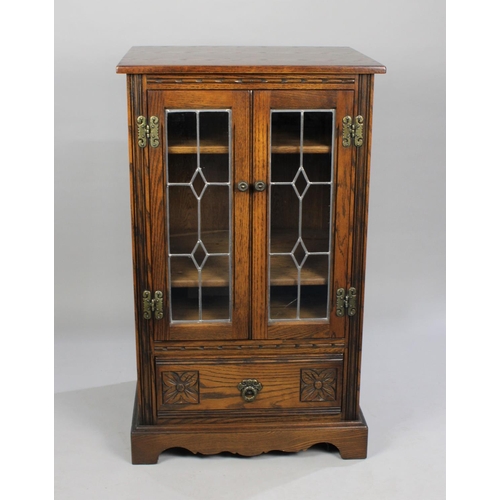 321 - An Old Charm Media Cabinet with Leaded Glazed Doors to Glazed Top Section and Base Drawer, 59cms Wid... 