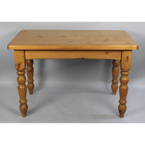 344 - A Modern Rectangular Pine Kitchen Table, Turned Supports, 122cms by 76cms