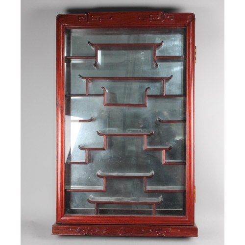 360 - A Modern Oriental Style Glazed Wall Hanging Display Cabinet with Multiple Shelves and Mirrored Back,... 