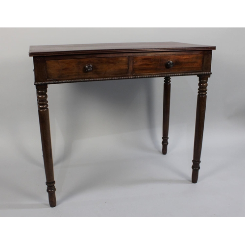 111 - A Late 19th/Early 20th Century Mahogany Two Drawer Side Table on Turned Supports, 90cm wide