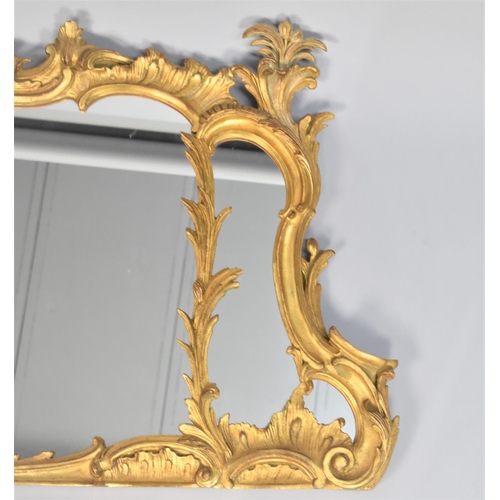 196 - A Large and Ornate Gilt Framed Over Mantle Mirror, 150cm wide