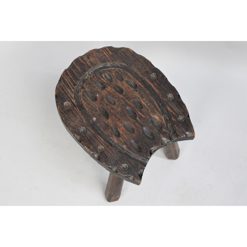 203 - A Mid 20th Century Three Legged Stool with Carved Top in the Shape of a Horseshoe, 35cm wide