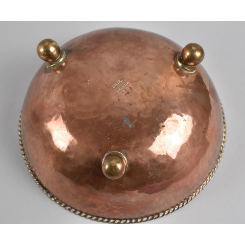 22 - An Arts and Crafts Hammered Copper Bowl, C.1915, Raised on Three Ball Feet with Rope Work Rim. Desig... 