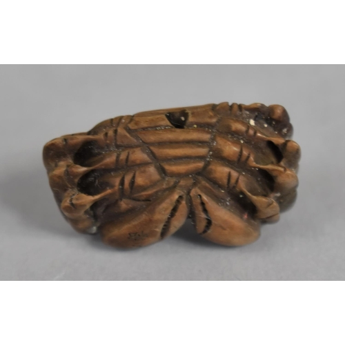 232 - A Small Japanese Carved Wooden Netsuke in the form of a Crab, Signed