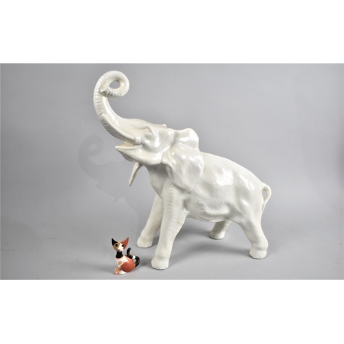 300 - A Large White Glazed Ceramic Study of an Elephant Together with a Goebel Rosina Wachtmeister Cat