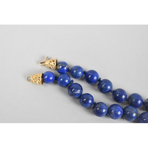 343 - A Graduated Single Row Lapis Lazuli Bead Necklace, 63cm